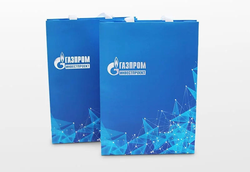 Бумажные пакеты: два голубых пакета Газпром инвестпроект с логотипом на заказ