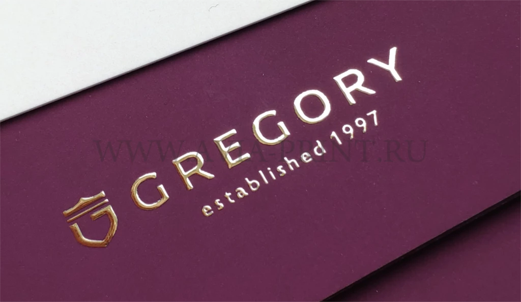 Золочение логотипа Gregory established 1997 на бордовом картоне на заказ