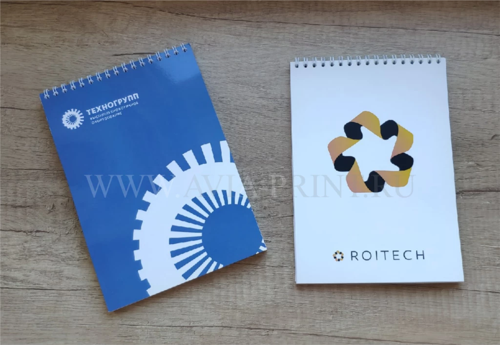 Фирменные блокноты на пружине Техногрупп синий и ROITECH белый с логотипом на заказ